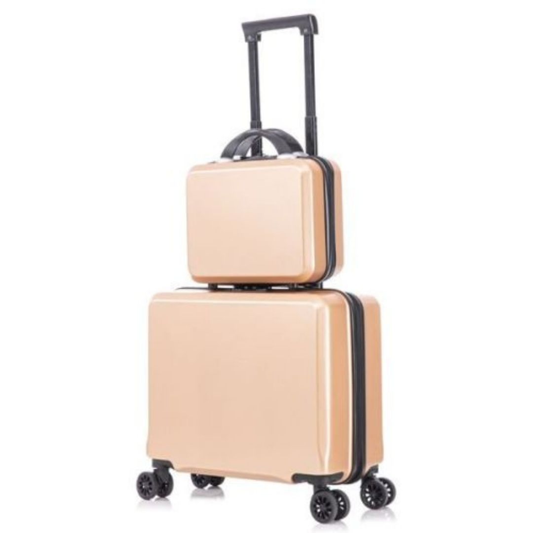 A two-piece hardshell luggage set in a rose gold color, with a small carry-on suitcase and a matching vanity case stacked on top.